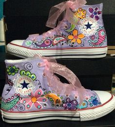 Custom Painted Lavender Converse with Floral, paisley and blue butterflies on Pink Hi Top All Stars. Super cute and popular design. Personalized with your child's name. Just send the name in notes to seller. This listing is for a Converse Custom Kids size 10.5 to youth 3 rendition of this design ~Many colors, flowers, paisley and butterflies and your child's name. I send original laces as well as ribbon laces to match the colors. I can do these in a number of custom color combinations too, to ma Diy Painted Converse High Tops, Purple Custom Converse, Designed Converse, Fun Hand Painted High-top Sneakers, Lavender Converse, Butterfly Painted Shoes, Painted Converse High Tops, Custom Converse High Tops Butterfly, Hand Painted Multicolor Low-top Custom Sneakers