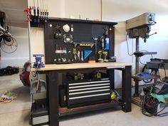 a workbench with tools and other items on it