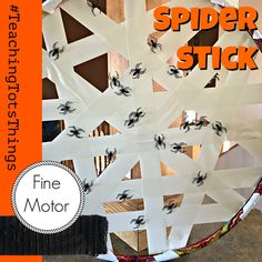 a paper plate spider stick is on display