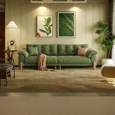 a living room with green couches and pictures on the wall above them, along with other furniture