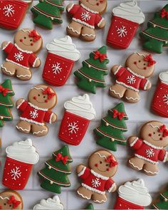 many decorated cookies are displayed on a table