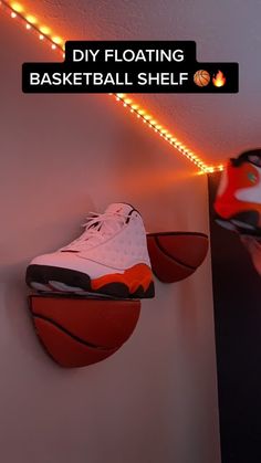 a pair of shoes hanging on the wall next to a basketball