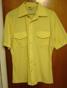 MONTGOMERY WARD vtg small beat-up button-down shirt rockabilly mod pockets hip This is a previously-owned, adult-small (S), yellow, short-sleeved button-down shirt. It measures approximately 19 inches (from underarm seam to underarm seam) and is in fair condition, as there are a few small marks on the front near the very bottom (Montgomery Ward brand, 100% polyester). It will need professionally laundered or dry-cleaned for maximum satisfaction… Montgomery Ward (later known as Wards or Monkey Wa Retro Fitted Camp Shirt For Spring, Retro Fitted Collared Camp Shirt, Fitted Retro Collared Camp Shirt, Fitted Collared Retro Camp Shirt, Fitted Summer Camp Shirt With Pockets, Fitted Camp Shirt With Pockets For Summer, Fitted Casual Camp Shirt With Buttons, Yellow Short Sleeve Shirt With Pockets, Retro Collared Top With Placket