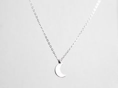 This sweet crescent moon and delicate chain will glint and glitter by the light of the sun or the moon. - solid sterling silver moon charm and chain - chain finished with a lobster clasp, available in 14, 16, 18 or 20 inches - ready to ship within 1-3 days of purchase - additional lengths available upon request Let's keep in touch! Instagram, @thebealine facebook.com/thebealine Please see my policies page for more information regarding jewelry care, shipping, exchanges, etcetera. If you are inte Dainty Silver Moon Charm Necklaces, Minimalist Moon Phase Charm Necklace, Delicate Moon Phase Charm Necklaces, Dainty Silver Moon Charm Necklace, Minimalist Silver Moon Charm Necklaces, Silver Half Moon Charm Necklaces, Silver Half Moon Charm Necklace, Celestial Half Moon Sterling Silver Necklace, Sterling Silver Moon Phase Charm Necklace