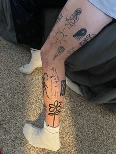 a person with tattoos on their legs and feet