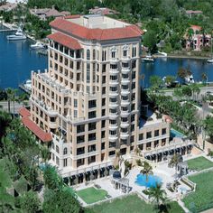 an aerial view of a large building near the water