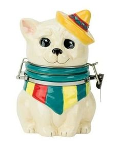 a ceramic dog with a hat and scarf