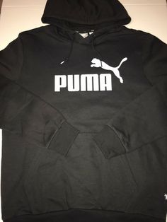 PUMA Essentials Logo Hoodie Men’s Medium Black This hoodie is brand new without tags. I purchased three colors but simply haven’t worn the black one as I don’t wear a lot of black. It’s a classic, ageless design from Puma. It’s a comfortable, warm hoodie with an athletic, regular fit. Not overly baggy like most athletic branded hoodies. It features a kangaroo pocket, drawstring hood, ribbed cuffs and hem, and a large screen-printed logo at the chest. Check out my other items for sale. Inventory Casual Black Hoodie With Branding, Black Hooded Hoodie With Branding, Black Cotton Hoodie With Branding, Black Fleece Hoodie With Branding, Branded Hoodies, Essentials Logo, Puma Hoodie, Puma Sport, White Puma