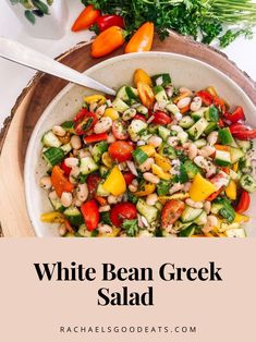 white bean greek salad with tomatoes, cucumbers and parsley on the side