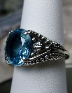 Excited to share the latest addition to my #etsy shop: 3ct Oval Cut Sim Blue Aquamarine Gemstone Sterling Silver Gothic Filigree Ring {Made to Order} #85 https://etsy.me/2LLbnL4 #jewelry #ring #sterling #silver #no #rosegold #yes #girls #blue Exquisite Oval Gemstones With Accents, Elegant Blue Topaz Cabochon Ring, Oval Sapphire Ring With Gemstone Accents, Heirloom Oval Sapphire Ring With Gemstone Accents, Classic Oval Jewelry With Gemstone Accents, Oval Sapphire Jewelry With Gemstone Accents, Exquisite Oval Topaz Rings, Exquisite Blue Oval Jewelry, Oval Sapphire Gemstones With Accent Stones