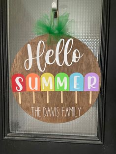 a door hanger that says hello summer the davis family