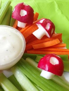 some vegetables and dip are arranged in the shape of mushrooms on top of each other