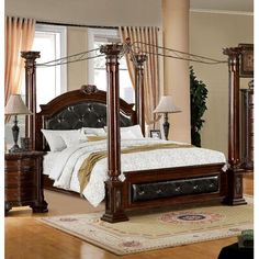 a bedroom with four poster bed, dresser and mirror