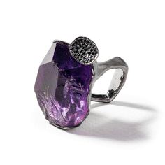 a purple ring with a black diamond on it