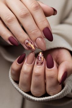 Get ready to embrace the cozy vibes of autumn with these stunning almond-shaped fall nail ideas! Featuring rich burgundies, deep greens, and a sprinkle of gold flakes, these nails perfectly capture the essence of fall. The elegant almond shape enhances the design, providing a modern twist that窶冱 both stylish and seasonal. Elevate your nail game this autumn and let your fingers do the talking! #FallNailIdeas #NailArt #AutumnNails #AlmondNails #NailInspo Fall Nail Ideas, Simple Fall Nails, November Nails, Fall Nail Trends, Almond Nails Designs, Almond Shape, Thanksgiving Nails, Almond Shaped