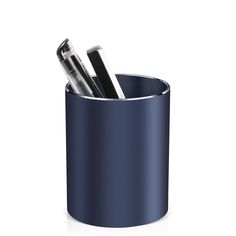 two pens in a blue cup on a white surface with the same pen holder as it is