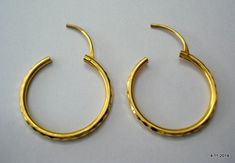 "traditional design 20k gold hoop earring pair from rajasthan india. nice handmade design made of 20k yellow gold, good for jewelry collection. weight - 3.7 grams diameter - 2.7 cm (1\") width - 2 mm material - 20k yellow gold." 22k Gold Round Hoop Earrings, Traditional Small Hoop Hallmarked Earrings, Traditional Small Hoop Huggie Earrings Hallmarked, Traditional Small Hoop Yellow Gold Earrings, Traditional Handmade Yellow Gold Hoop Earrings, Small Hoop 22k Yellow Gold Earrings, Traditional Small Hoop 22k Gold Earrings, Traditional 22k Gold Small Hoop Earrings, Traditional Bronze Brass Hoop Earrings