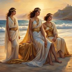 three women dressed in ancient greek clothing sitting on the beach