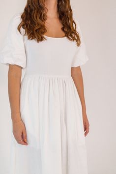 + fresh white color+ scoop neckline with puffed sleeve+ hidden side pockets+ mid-axi length skirt with pleated detailing+ mixed media knit top and poplin skirt Casual Puff Sleeve Dress With Pleated Sleeves, Spring Dresses With Smocked Back And Voluminous Skirt, Casual Dress With Voluminous Tiered Skirt, Cotton Midi Dress With Puff Sleeves, White Dress With Puff Sleeves And Voluminous Skirt, Tiered Skirt Dress For Day Out, Casual Puff Sleeve Dress With Pleated Sleeves For Spring, Casual Dresses With Puff Pleated Sleeves, White Voluminous Short Sleeve Dress