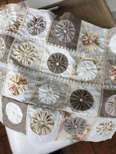 an old quilt with many different designs on it