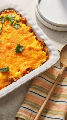 a casserole dish with cheese and herbs