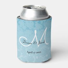 a blue and white can cooler with the letter m on it