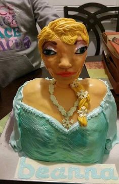 a cake with a woman's face on it