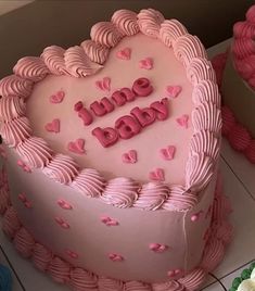 two heart shaped cakes sitting on top of a table