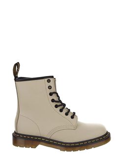 Dr Martens lace-up boot in parchment beige with black leather detail, round toe and rubber sole with yellow stitches. Beige Lace-up Boots With Leather Sole, Beige Leather Sole Lace-up Boots, Classic Beige Ankle Boots, Beige Lace-up Boots For Streetwear, Beige Lace-up Boots With Rubber Sole, Beige Round Toe Boots With Stitched Sole, Beige Boots With Stitched Sole And Round Toe, Beige High-top Boots With Leather Sole, Beige High-top Boots For Streetwear