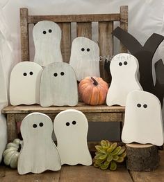 a wooden bench with halloween decorations on it