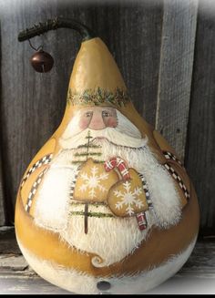 a pear with a santa clause painted on it