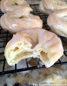 doughnuts are cooling on a rack in the oven, and then glazed with icing