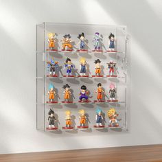 a display case filled with anime figurines sitting on top of a wooden table