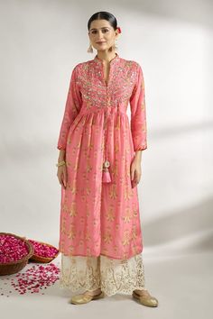 Pink gathered jacket style tunic with all-over floral prints, embroidered yoke and sleeves. - Aza Fashions Transitional Long Sleeve Dresses With Floral Print, Transitional Long Sleeve Floral Print Dresses, Navratri Long Sleeve Kurta With Yoke, Long Sleeve Floral Print Transitional Dresses, Traditional Sets With Yoke For Spring, Spring Designer Wear Tunic With Floral Embroidery, Spring Designer Tunic With Floral Embroidery, Traditional Spring Set With Yoke Detail, Spring Festive Tunic With Printed Motifs