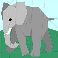 an elephant made out of paper on a green field