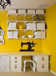 a sewing machine wall decal in a room with yellow walls and white dressers