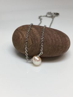 "5mm Peach cream solitaire fresh water pearl hypoallergenic stainless steel sturdy shiny cable chain lobster claw closure necklace. Available in 14\",15\",16\", 18\" Hand made jewelry! All purchase will arrive in gifts boxes Thanks for stopping by! See similar listings https://www.etsy.com/listing/746071892/single-pearl-necklace-solitaire-pearl?ref=shop_home_active_1&frs=1 https://www.etsy.com/listing/746055542/single-pearl-necklace-solitaire-pearl?ref=shop_home_active_3&frs=1" Pearl Necklace With Cable Chain For Gift, Stainless Steel Pearl Chain Necklace For Gift, Gift Jewelry With Pearl Chain In Stainless Steel, Gift Jewelry With Pearl Chain And Stainless Steel, Stainless Steel Jewelry With Pearl Chain For Gifts, Pearl Cable Chain Necklaces As Gift, One Pearl Necklace, Gifts Boxes, Single Pearl Necklace