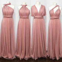 three bridesmaid dresses on mannequins in front of a white wall