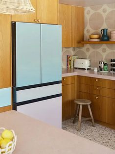 a kitchen with wooden cabinets and white counter tops