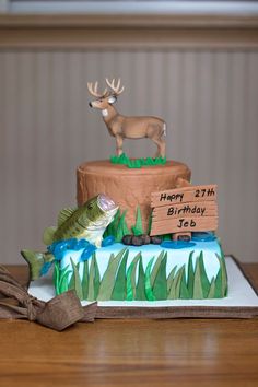 a birthday cake with a deer on top