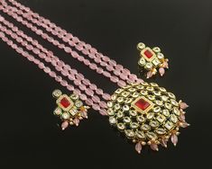 This is a stunning handmade necklace perfect for high end Jewelry Collector, a keeper in Traditional Vintage Indian/Pakistani Bridal jewelry and a Luxury Gift for your Daughter, Sister or Wife on Wedding or Anniversary. Perfect for any type of occasions, weddings And celebrations and a beautiful & memorable gift for weddings and special occasions. -Item Code:- L9706 -Pink Monalisa Rajwada Necklace Set with Earrings. -Designer pink beaded necklace with Polki Diamond pendant. -Gold Plated Set with Kundan Stones which shine like polki. -Metal: Gold plated brass -Earrings are 43mm long and 30mm wide -Push Back Earrings -Necklace length with pendant 12" approx excluding dori/cord -Quantity:- One Necklace Set Please see more different designs here:- https://www.etsy.com/in-en/shop/LUCKYJEWELSART Polki Diamond Necklace, Trendy Bridesmaids, Pink Beaded Necklace, Pakistani Bridal Jewelry, Rani Haar, Diamond Necklace Set, Gemstone Beaded Necklace, Bridesmaid Necklace, Vintage Indian