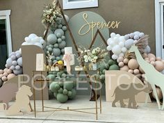 an outdoor display with balloons and animals