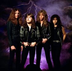 an image of four people standing in front of lightning