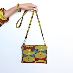 "African print shoulder bag featuring zip fastening, detachable shoulder strap and inside zipper pocket.  Height: 6.5\" Width: 9.75\" Strap: 44\"" Drawstring Bucket Bag, Printed Drawstring, Printed Bags, African Print, Purses And Handbags, Bucket Bag, Zipper Pocket, Shoulder Bags, Clutch Bag