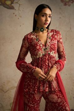 Red Printed Chiffon Peplum Paired With Printed Chiffon Gharara and Net Dupatta Fabric: Peplum: Chiffon Gharara: Chiffon Dupatta: Net/organzaColor: Red PrintedNo. of Components: 3Wash Care: Dry Clean OnlyStyle Code: RMIC-42