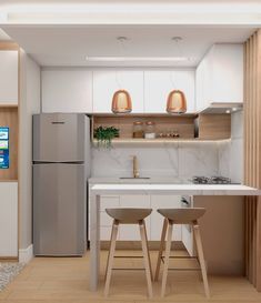 a kitchen with two stools next to a counter and refrigerator freezer in it