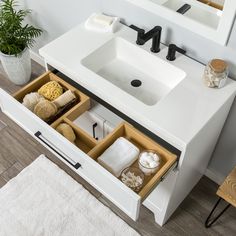 a bathroom sink with drawers underneath it