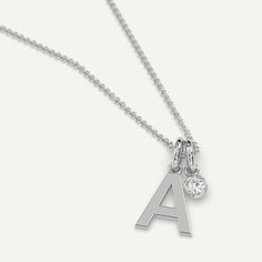 A personalized initial necklace pendant design featuring a letter A charm. This beautiful women's letter necklace is approx. 1cm tall and comes in solid 14k white or yellow gold with an optional 0.05 carat (3mm) diamond and an adjustable 16 inch - 18 inch chain. For all other letters, check out our initial necklace collection. Everyday Diamond Initial Necklace, Classic Diamond Initial Necklace, Classic White Gold Charm Necklaces, Classic White Gold Charm Necklace With Initials, Silver Diamond Name Necklace With Initials, White Gold Sterling Silver Initial Pendant Charm Necklace, Minimalist Polished Initial Pendant Necklace, Minimalist Initial Pendant Necklace With Polished Finish, Elegant Sterling Silver Initials Charm Necklaces