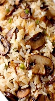 rice with mushrooms and green onions in a white bowl