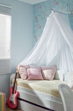 a bed with a white canopy over it